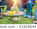 Grilled barbecue and sweet corn on stove at camping site 61826644