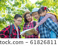 Happy asian family trekking in forest together on vacation 61826811