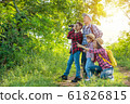 Happy asian family trekking in forest together on vacation 61826815
