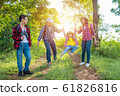 Happy asian family trekking in forest together on vacation 61826816