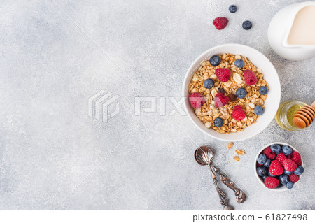 Healthy breakfast. Fresh granola, muesli with 61827498