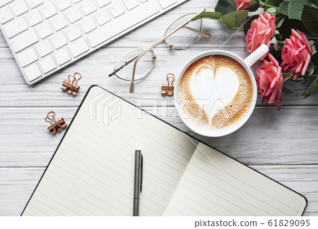 A cup of coffee with heart pattern A cup of coffee with heart pattern 61829095
