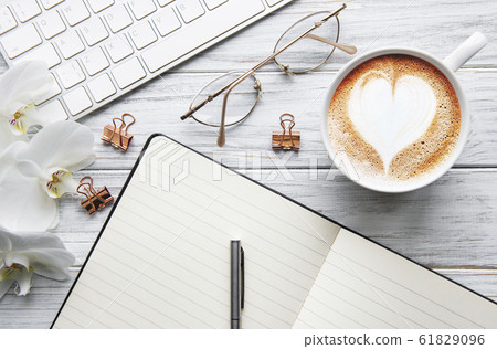 A cup of coffee with heart pattern A cup of coffee with heart pattern 61829096