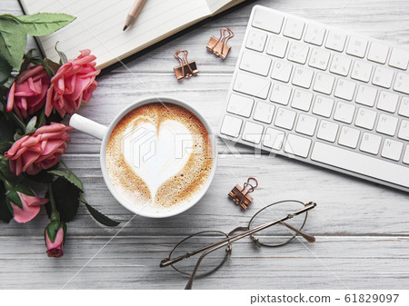 A cup of coffee with heart pattern A cup of coffee with heart pattern 61829097