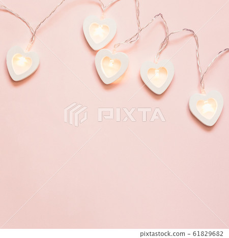 Romantic pink background with heart garland. Romantic pink background with heart garland. 61829682