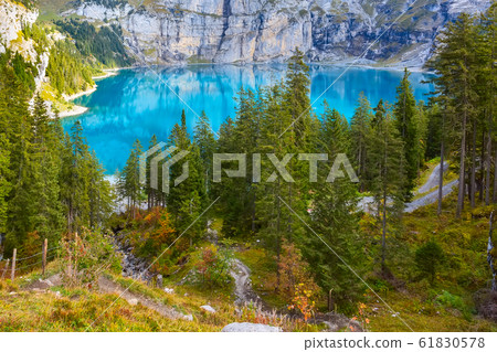 Panorama of Oeschinensee lake and Alps, Switzerland. 61830578