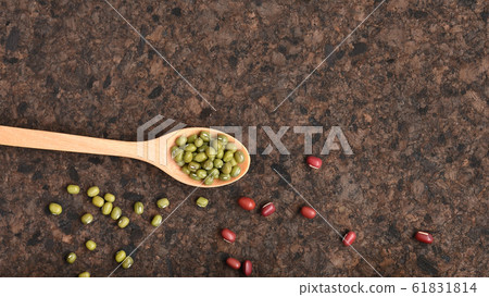 close up of green bean in wooden spoon with red beans close up of green bean in wooden spoon with red beans 61831814
