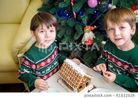 Two sweet boys, brothers, making gingerbread Two sweet boys, brothers, making gingerbread 61832026