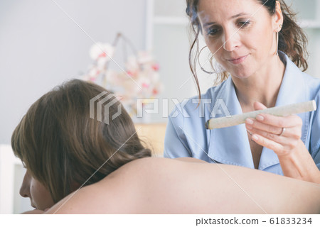 Therapist doing moxa treatment Therapist doing moxa treatment 61833234
