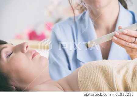 Therapist doing moxa treatment Therapist doing moxa treatment 61833235