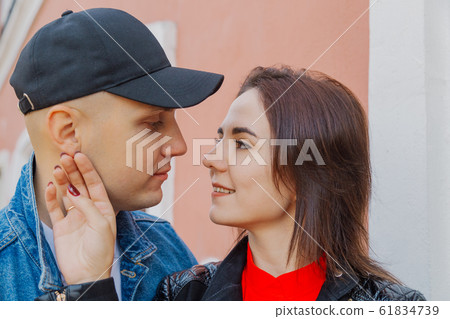 Happy lovers in the park near the wall. Autumn 61834739