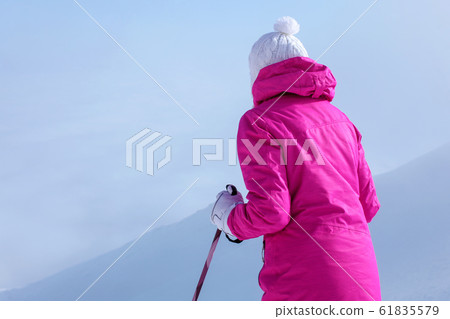 Look from behind, young woman in pink ski jacket, Look from behind, young woman in pink ski jacket, 61835579