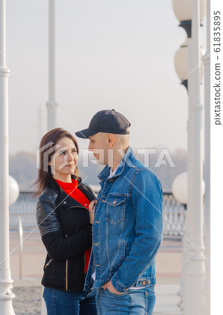 Loving couple at the lanterns on the promenade. Loving couple at the lanterns on the promenade. 61835895
