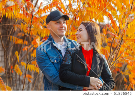 Happy couple in love on a background of yellow 61836845
