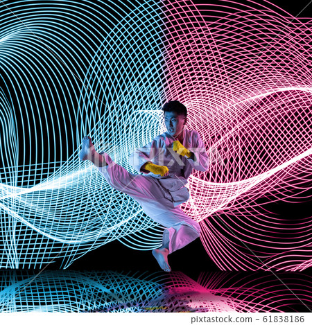 Creative sport and neon waves on dark neon lighted line background Creative sport and neon waves on dark neon lighted line background 61838186
