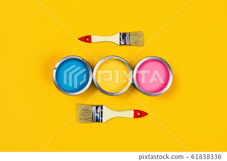 Colored background with paint jars and brushes. 61838336