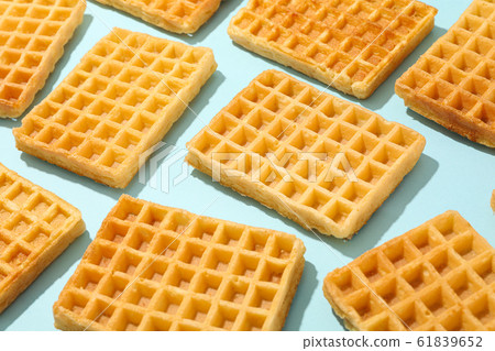 Flat lay composition with belgian waffles on color Flat lay composition with belgian waffles on color 61839652