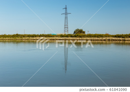 power line pylon stands on the banks  61841090