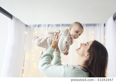 Mother with her little baby Mother with her little baby 61842847