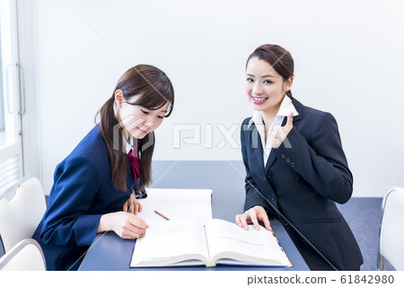Studying for an examination High school girls and instructors Good job Studying for an examination High school girls and instructors Good job 61842980
