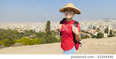 Girl is standing on hill and looking at Athens, Girl is standing on hill and looking at Athens, 61844486