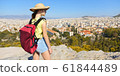 Girl is standing on hill and looking at Athens, 61844489