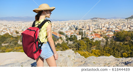 Girl is standing on hill and looking at Athens, Girl is standing on hill and looking at Athens, 61844489