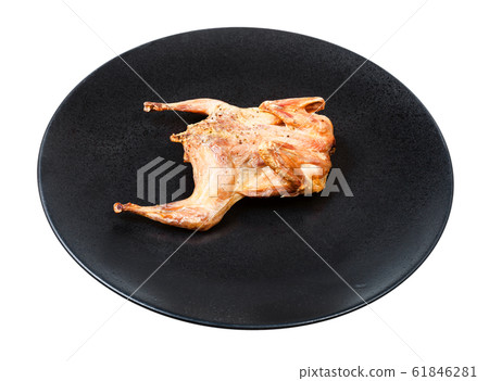roasted whole quail on black plate isolated roasted whole quail on black plate isolated 61846281
