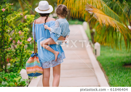 Portrait of little girl and mother on summer vacation Portrait of little girl and mother on summer vacation 61846404