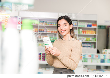 pleased customer in a store. beautiful smiling woman choosing the right product pleased customer in a store. beautiful smiling woman choosing the right product 61846406