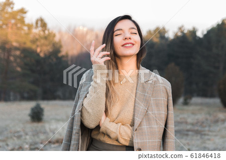 feminist movement. cheerful woman in casual clothes enjoying her existence out in nature feminist movement. cheerful woman in casual clothes enjoying her existence out in nature 61846418