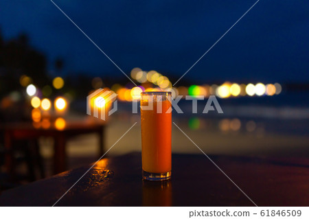 A glass glass of freshly squeezed juice in the A glass glass of freshly squeezed juice in the 61846509