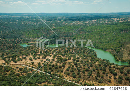 Tagus River in a valley with hills at the Monfrague National Park Tagus River in a valley with hills at the Monfrague National Park 61847618