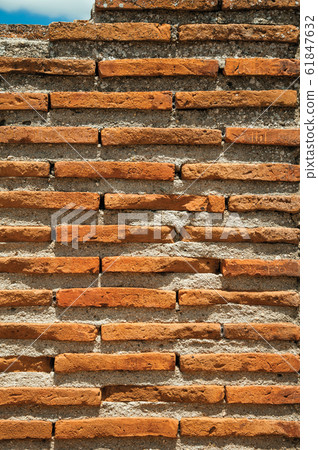 Wall made of small bricks Wall made of small bricks 61847632