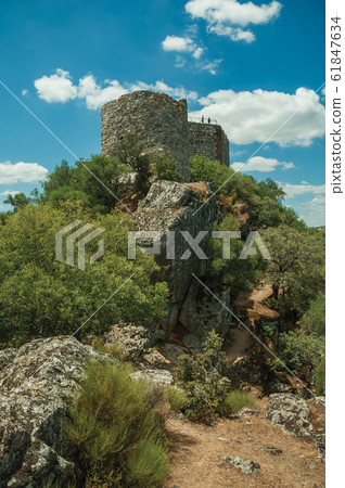 Castle on top of rocky cliff near the Tagus River at the Monfrague National Park Castle on top of rocky cliff near the Tagus River at the Monfrague National Park 61847634