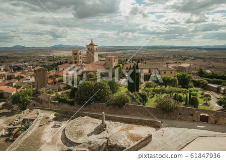 Buildings with church steeples and courtyard in Trujillo 61847936