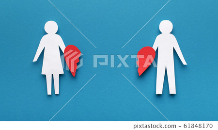 Papercut figures with broken heart on blue background Papercut figures with broken heart on blue background 61848170
