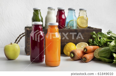 Different detox drinks with fresh components on white 61849010