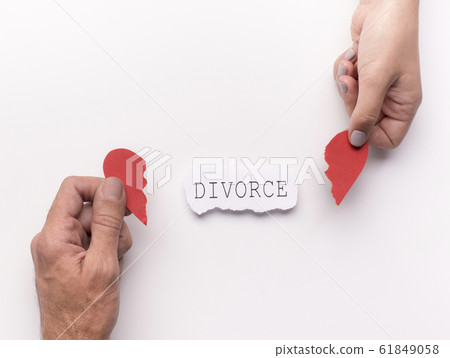Couple, family hands holding broken heart on white 61849058