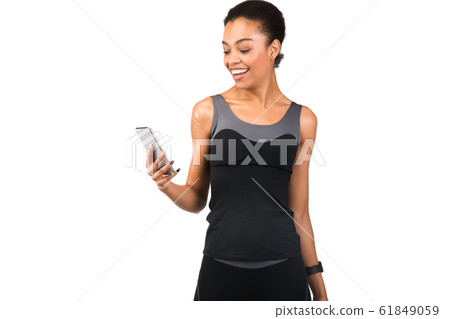Sporty African American Girl Using Smartphone On White Studio Background Sporty African American Girl Using Smartphone On White Studio Background 61849059