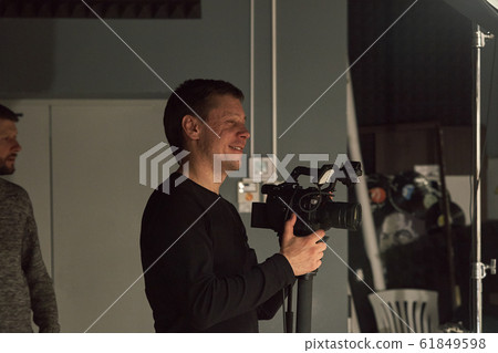 Behind the scenes of video production or video shooting, Film grain, selective focus, special illumination Behind the scenes of video production or video shooting, Film grain, selective focus, special illumination 61849598