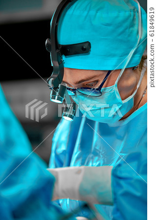 Surgeons team in the operating room, portraits close-up. modern operating, plastic surgery. Beauty industry 61849619