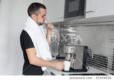 A young guy is going to work in the morning. A young guy is going to work in the morning. 61849856