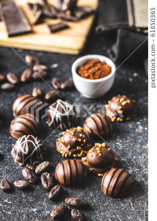 Praline bonbons. Chocolate truffles and cocoa 61850365