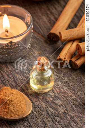 A bottle of cinnamon essential oil with true cinnamon 61850574