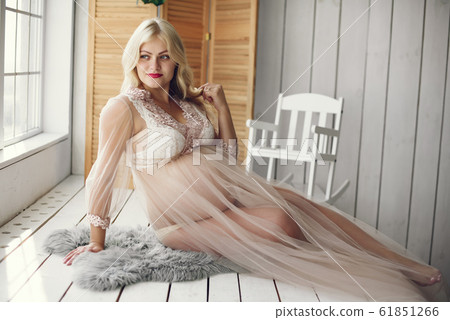 Beautiful pregnant woman with big belly in a studio Beautiful pregnant woman with big belly in a studio 61851266