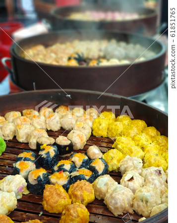 Colorful steamed dim sum, chinese dumpling in a Colorful steamed dim sum, chinese dumpling in a 61851765
