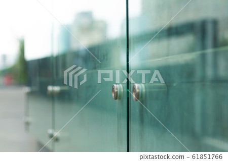Soft focus, glass fence of a modern city of glass Soft focus, glass fence of a modern city of glass 61851766