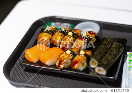 Fresh sushi rolls in an asian food store 61851769