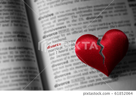 Red broken heart on dictionary divorce definition. 61852064